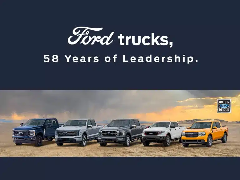 Lineup of Ford trucks on a desert landscape with text "Ford trucks, 58 Years of Leadership."